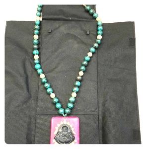 Beaded necklace with buddha pendant